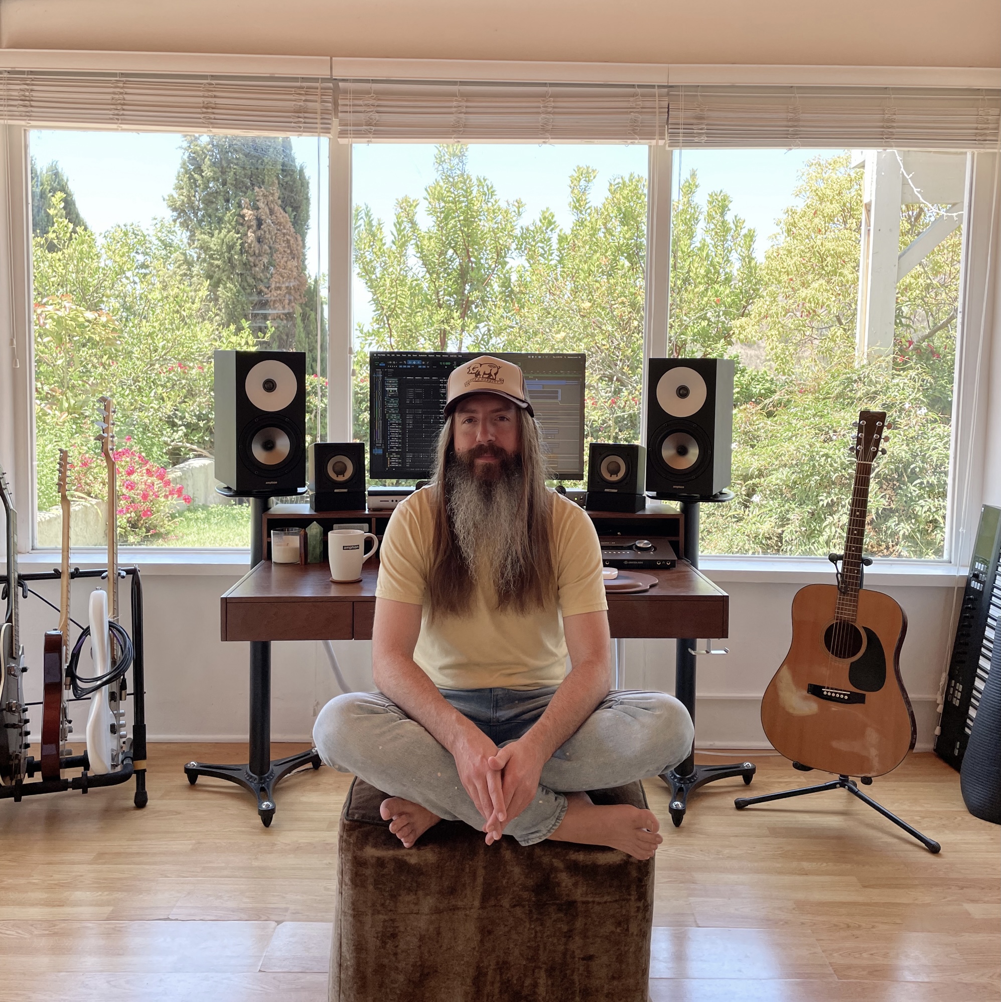 Damien Lewis at his home studio with his One18 and FlexBase25